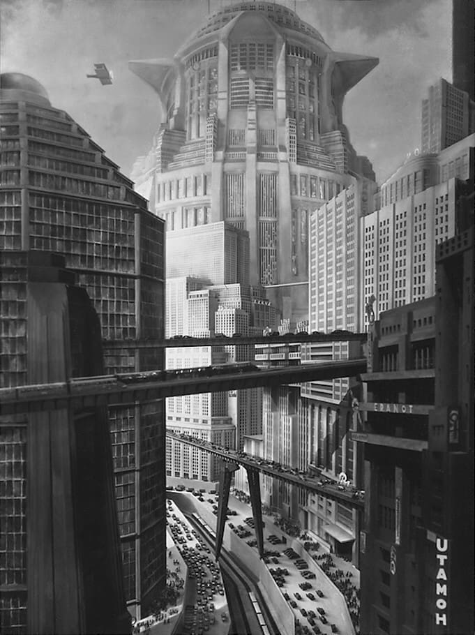Epische Szene der reichen, kapitalistischen Oberstadt, mit visionärem Verkehr und hohen glitzernden Türmen; ein halbes Jahrhundert später inspirierte diese Szene das dystopische Los Angeles in Blade Runner