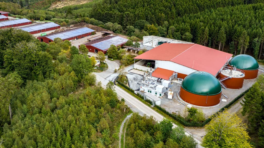 Biogas plant in Germany, surrounded by a forest