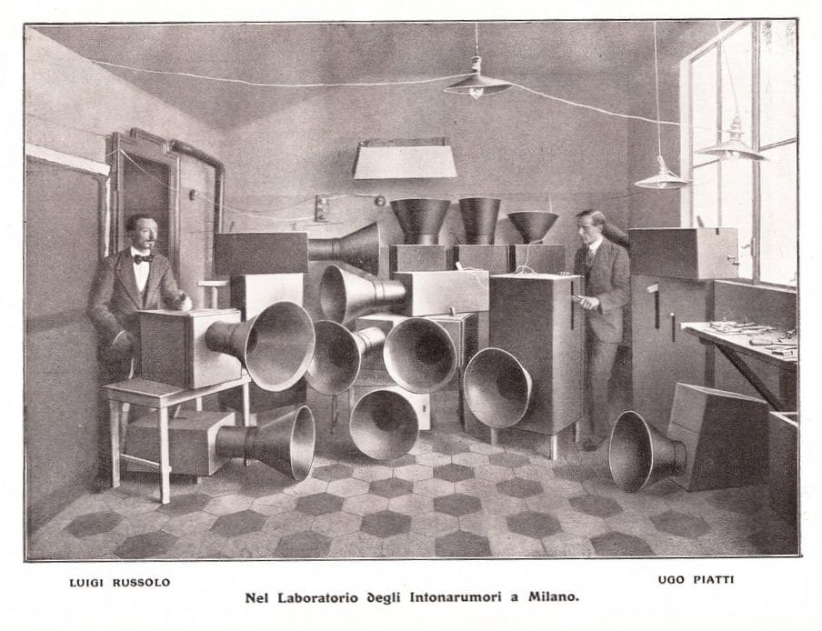 Group of noise-generating machines in a room; photo from 1913