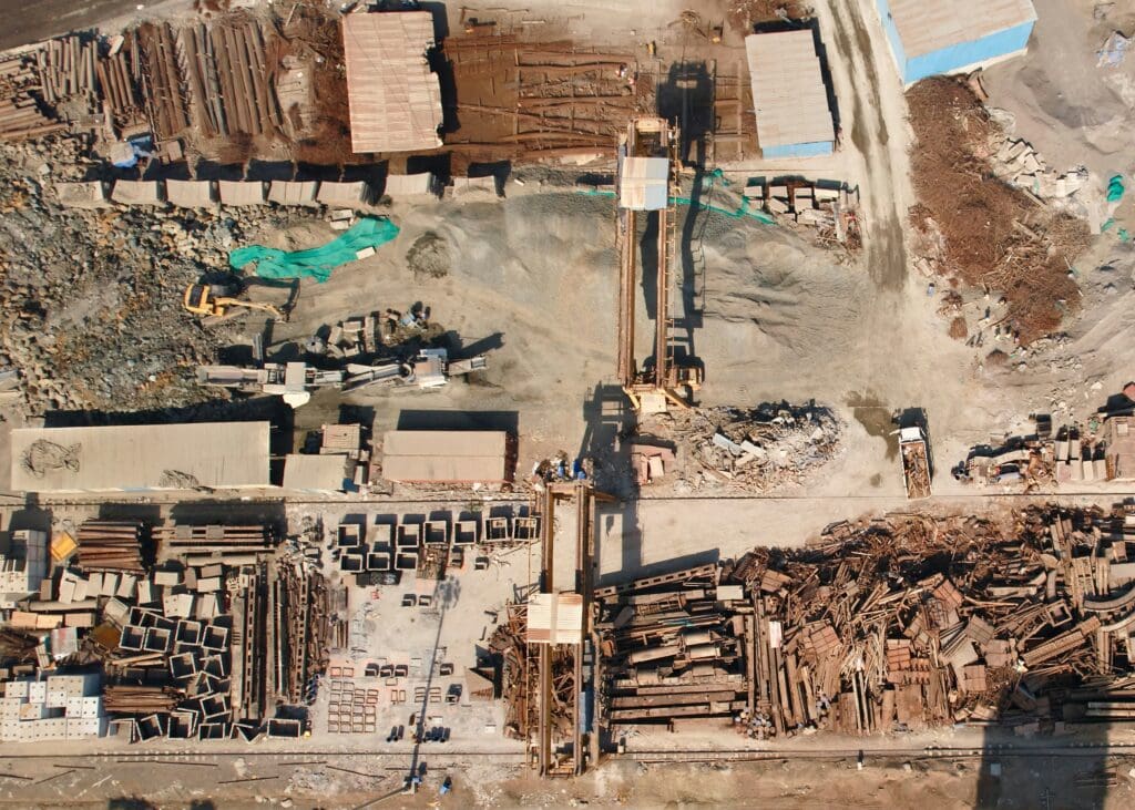 Arial view of used construction material lying on a scrapyard
