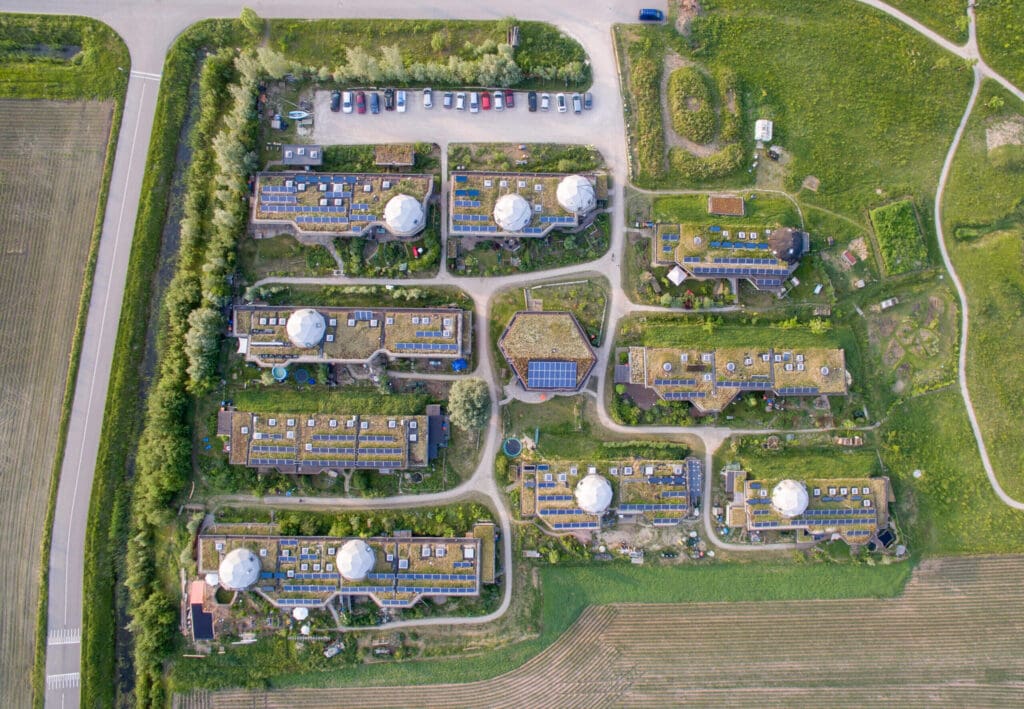 Top-down aerial view of the eco-village, consisting of 23 houses and a community center